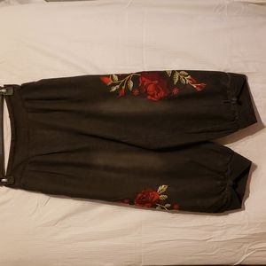 Yesno Black Jeans with matching rose embroidery on the outside of both legs.